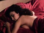 Sherilyn Fenn First Seen Reclining On A Bed As A Guy