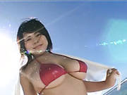 Busty Japanese Harlow Puchi Dib Shows Off Her Charms At The Beach