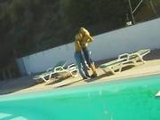 Two Women  Enjoy Each Other For Poolside Snack