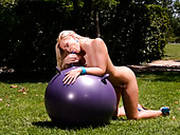 Lusty Blond Haired Wench Masturbates With Big Gymnastic Ball On Green Grass