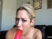 Capri Cavanni Likes To Lick Her Huge Dildo While Her Boyfriend Is Watching Her On Web Cam