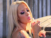 Helly Mae Hellfire In A Slit Dress Smoking A Cigarette And Posing