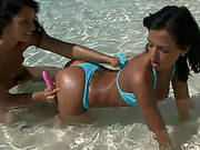 Black Angelika And Lucy Belle Are Standing Near The Water’s Edge
