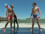 Wrestlers Offer An Exhibition In The Open Air. This Is Gay Fun Under The Sun!