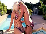 Two Girls Have Fun By The Pool