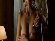 Penelope Cruz Standing In Front Of A Guy As She Removes Her