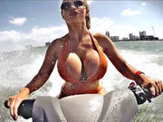 Nikki Benz Riding Watercraft Letting Her Tits Bounce Around With Every Wave Jump
